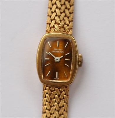 Lot 357 - GIRARD PERREGAUX - a lady's 18ct gold wrist watch