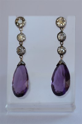 Lot 372 - A pair of amethyst and diamond pendant earrings