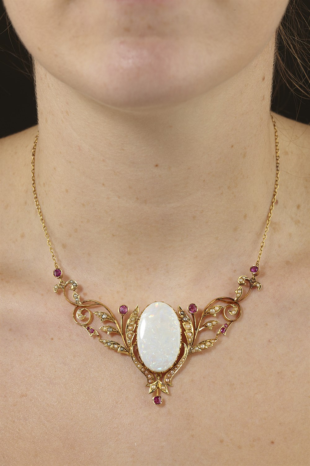 Lot 17 - An early 20th century opal and multi-gem set necklace