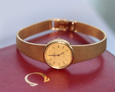 Lot 365 - OMEGA - a lady's 18ct gold cased wrist watch