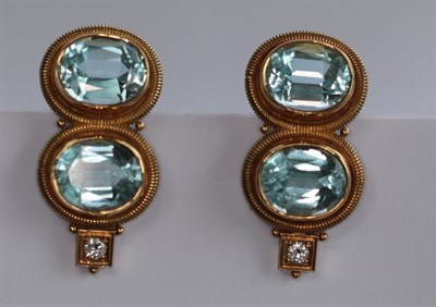 Lot 384 - A pair of 18ct gold mounted aquamarine and diamond set earrings