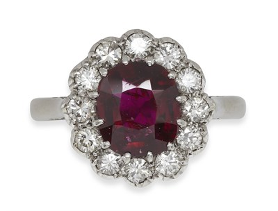 Lot 286 - A ruby and diamond set cluster ring