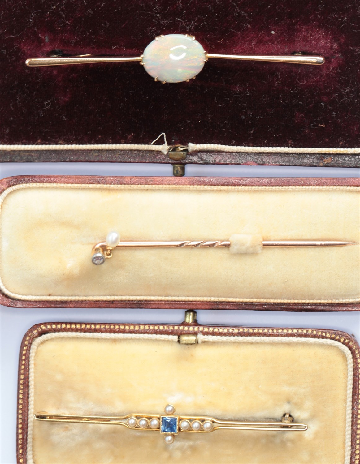 Lot 116 - Two gem set bar brooches and a stick pin