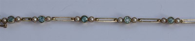 Lot 376 - An Edwardian 15ct gold mounted aquamarine and half-pearl set bracelet