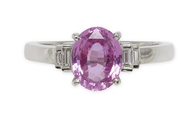 Lot 319 - An 18ct gold mounted pink sapphire and diamond set ring