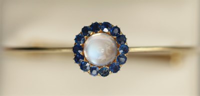 Lot 28 - A Victorian sapphire set crescent brooch