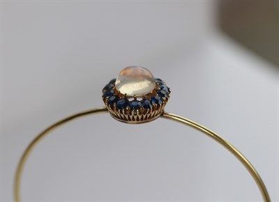 Lot 28 - A Victorian sapphire set crescent brooch