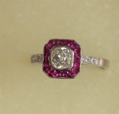 Lot 299 - An attractive Edwardian style ruby and diamond ring
