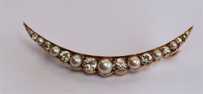 Lot 310 - A pearl and diamond set crescent brooch