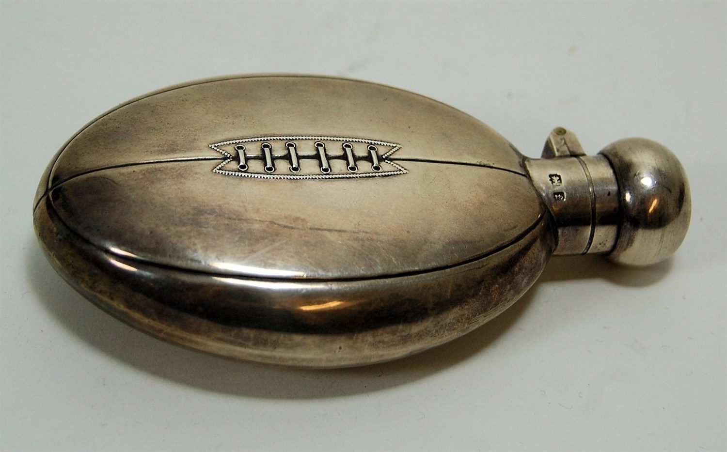 Lot 83 - A novelty rugby ball hip flask