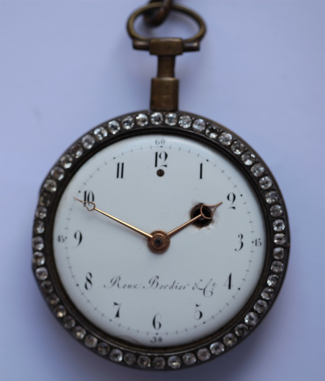 Lot 162 - ROUX BORDIER et Cie - a mid 19th century enamel cased open faced pocket watch with a chatelaine clip