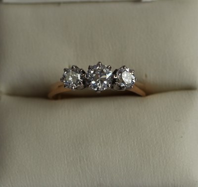 Lot 176 - A three stone diamond ring