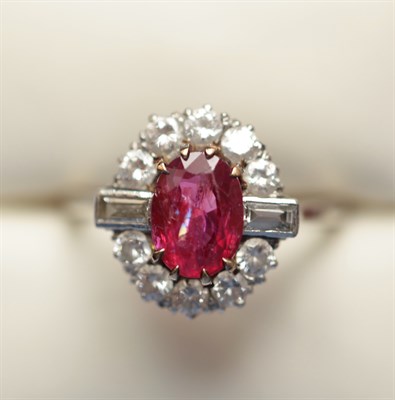Lot 333 - A ruby and diamond cluster ring