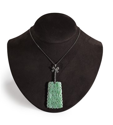 Lot 234 - An early 20th century jade and diamond set pendant