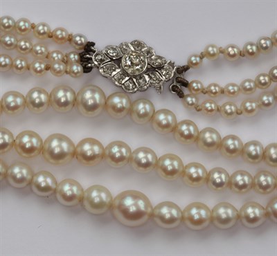 Lot 317 - A cultured pearl three-row necklace with diamond set clasp