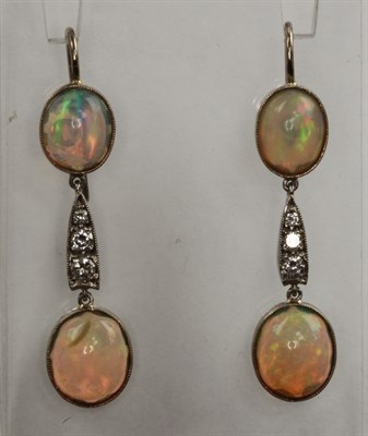 Lot 257 - A pair of opal and diamond set ear pendants