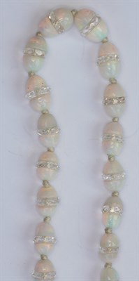 Lot 76 - A Belle Epoque opal and rock crystal bead necklace with diamond set clasp