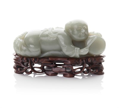 Lot 142 - A CELADON JADE FIGURE OF A BOY PLAYING A DRUM