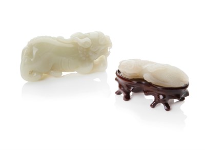 Lot 137 - TWO CELADON JADE FIGURES OF MYTHICAL BEASTS