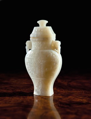 Lot 191 - AN ARCHAIC STYLE  WHITE JADE VASE AND COVER