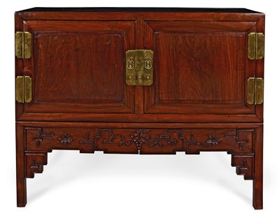 Lot 25 - A HUANGHUALI CABINET ON STAND