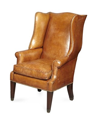Lot 43 - GEORGE III MAHOGANY AND LEATHER UPHOLSTERED WING ARMCHAIR