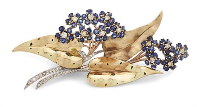 Lot 68 - A three coloured  metal brooch set sapphires and diamonds