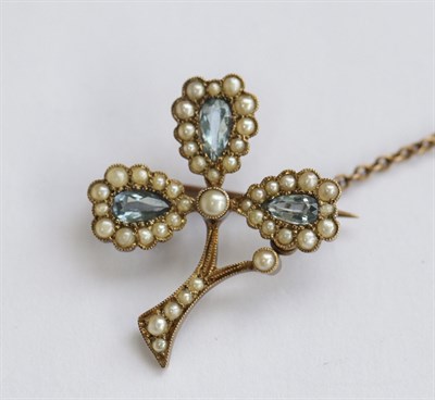 Lot 3 - An aquamarine and pearl set brooch