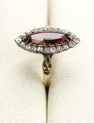 Lot 13 - A late Victorian garnet and diamond set cluster ring