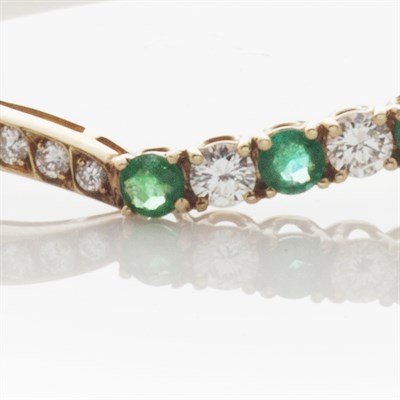 Lot 68 - An emerald and diamond set bangle