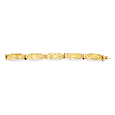 Lot 107 - An Egyptian inspired gold and diamond set bracelet