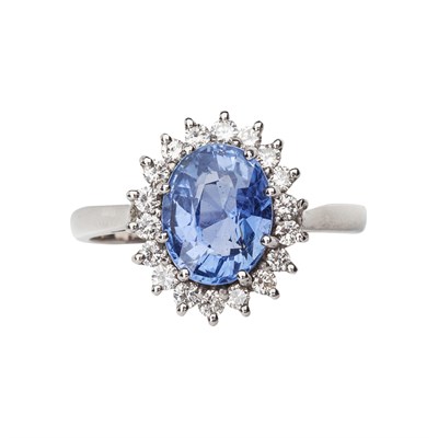 Lot 9 - An 18ct white gold, sapphire and diamond cluster ring