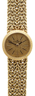 Lot 56 - BAUME ET MERCIER - A lady's 18ct gold wrist watch
