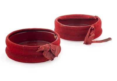 Lot 52 - A pair of red velvet mounted wine coasters