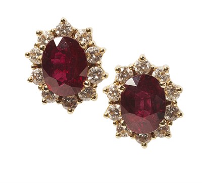 Lot 156 - A pair of ruby and diamond set earrings