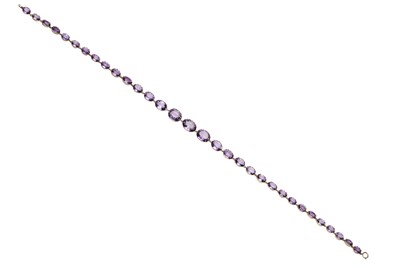 Lot 161 - An amethyst set riviere necklace