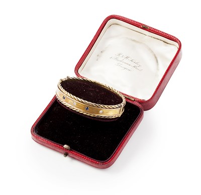 Lot 210 - A sapphire and diamond set bangle