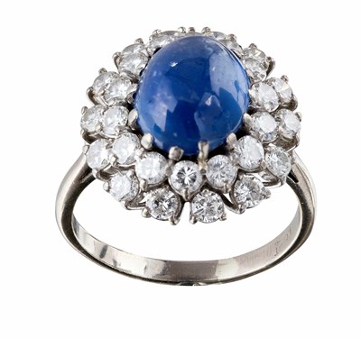 Lot 170 - A cabochon sapphire and diamond set cluster ring
