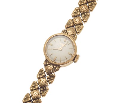 Lot 76 - LONGINES - A ladies 18ct gold wrist watch