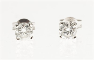 Lot 238 - A pair of diamond set ear-studs