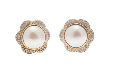 Lot 123 - A pair of pearl and diamond earrings