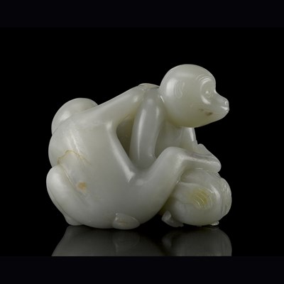 Lot 37 - LARGE PALE CELADON JADE 'MONKEY AND PEACH' GROUP