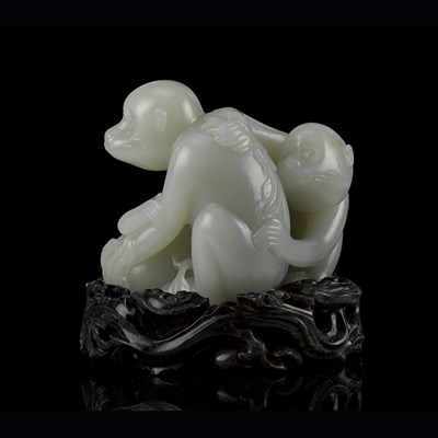 Lot 37 - LARGE PALE CELADON JADE 'MONKEY AND PEACH' GROUP