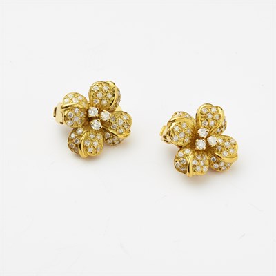 Lot 100 - A pair of diamond set floral earrings