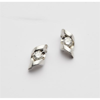 Lot 124 - A pair of platinum and diamond set earrings