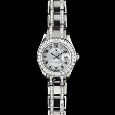 Lot 72 - ROLEX - A lady's 18k white gold and diamond set wrist watch