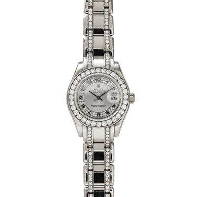 Lot 72 - ROLEX - A lady's 18k white gold and diamond set wrist watch