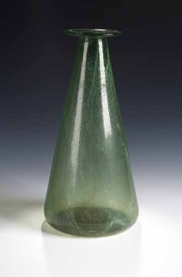 Lot 28 - A tall Clutha green glass vase, by James...