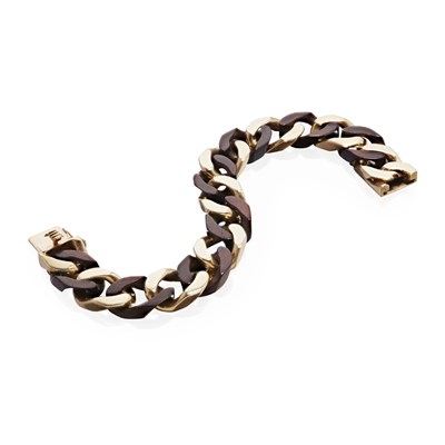 Lot 97 - A. PÉRY et CIE- A gold and ebonised wood link bracelet