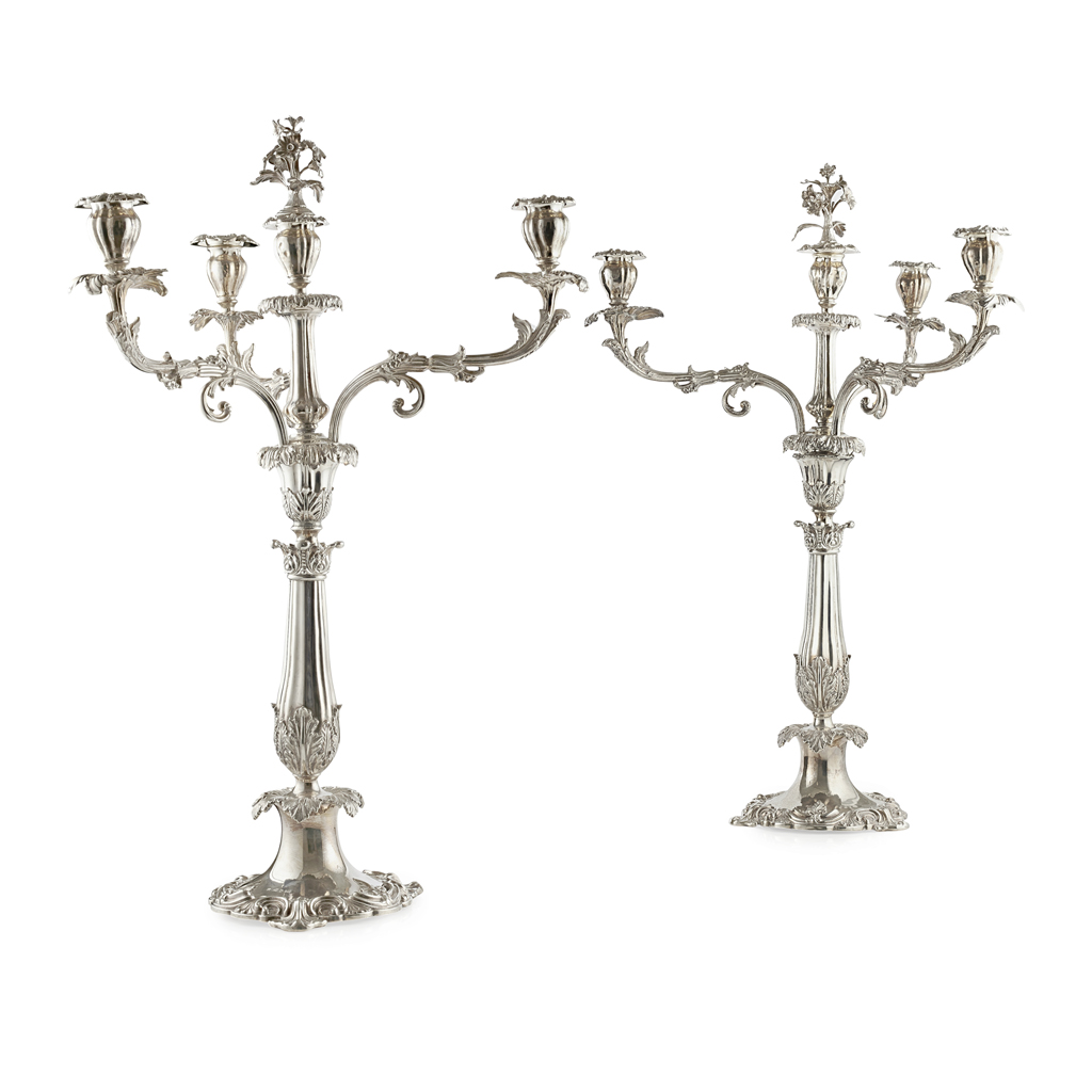 Lot 495 - A pair of  William IV four light table candelabra